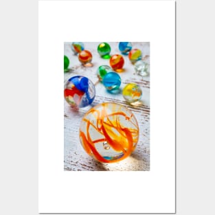 Glass Marbles On White Wooden Board Posters and Art